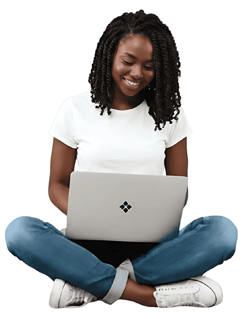 A smiling African female entrepreneur sitting cross-legged and working on a laptop, representing the digital marketplace services at Afilimart Digital.
